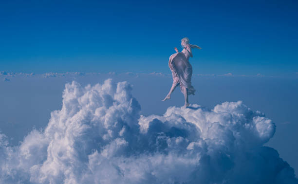 istock woman in the clouds 1939578699