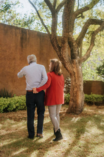 istock Senior couple hugging in garden 1939596239