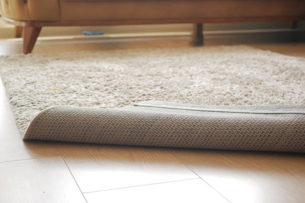 istock Carpet on the floor and sofa on background 1939600018