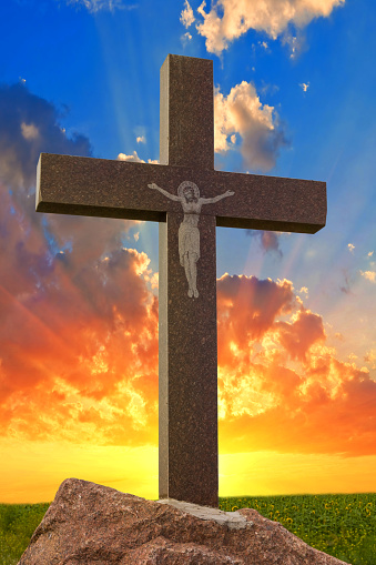 christian cross on a sunset background