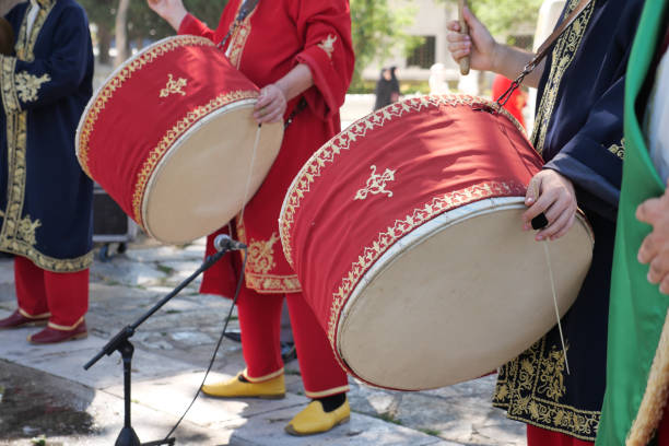 istock A man hit the ancient drum with Musical Instrument. 1939617312