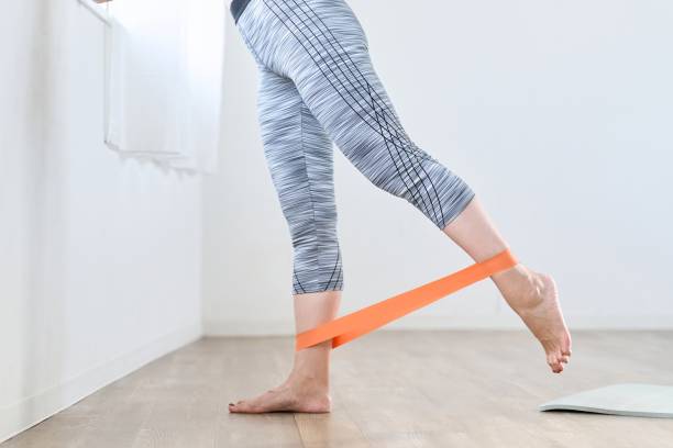 istock A woman doing lower body training using a resistance band 1939683118