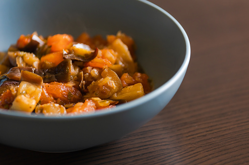 Soulful Comfort: Eggplant Stew in Blue Bowl Close-Up