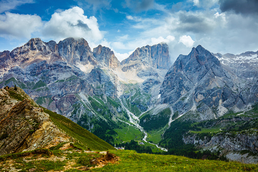 Summer time in Dolomites. landscape with mountains and clouds.