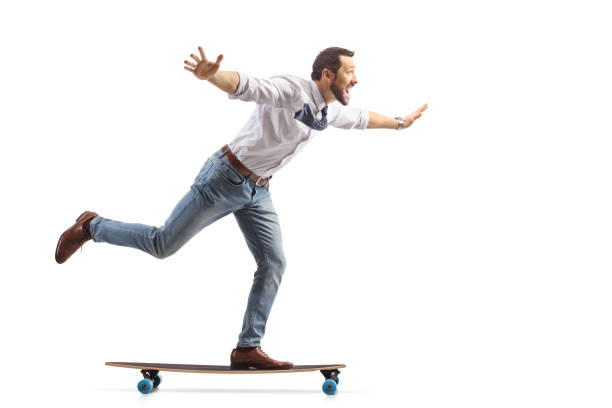 istock Joyful professional man riding on a skateboard 1939702086