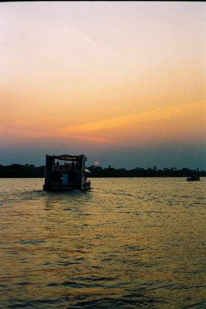 Magical Sunset over the Zambezi with a river boat on the water