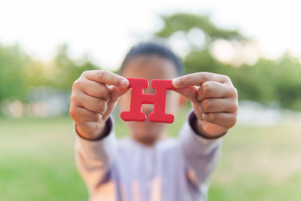 Child Holding Letter 