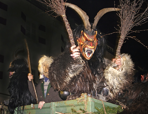 Unidentified man wears Krampus (devil) mask at traditional procession on December 5, 2006 in Zell am See, Austria - fear-mongering devil figures in the annual parade through town