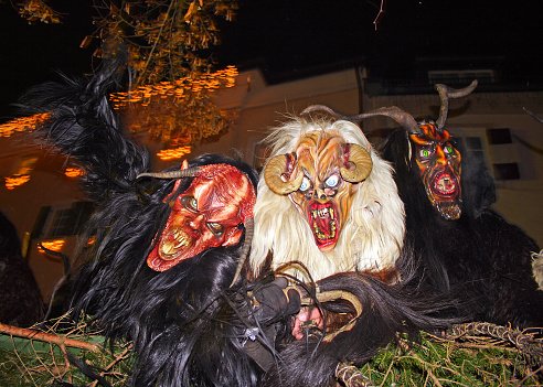 Unidentified man wears Krampus (devil) mask at traditional procession on December 5, 2006 in Zell am See, Austria - fear-mongering devil figures in the annual parade through town