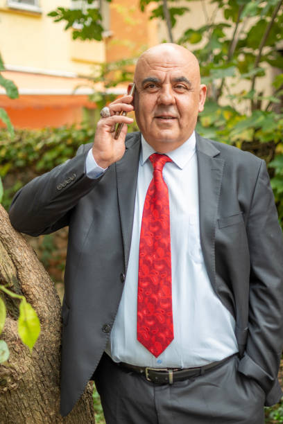 Portrait of a businessman checking his phone