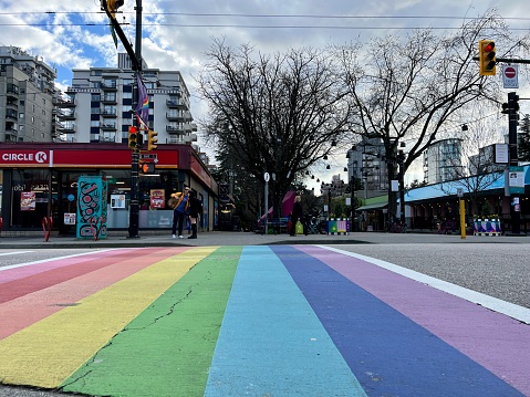 Davie and Bute rainbow sidewalks in downtown Vancouver's Gay Village Coimmunity on sunny afternoon streets for safe walking cars people love rainbow real life in Vancouver Canada 2023
