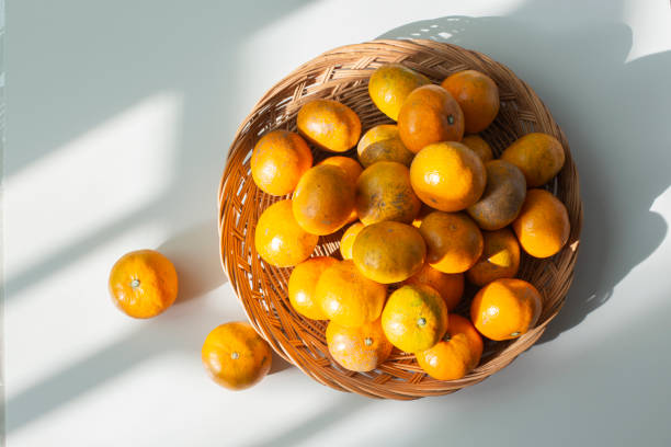 istock Tangerines on the wooden tray 1939779004