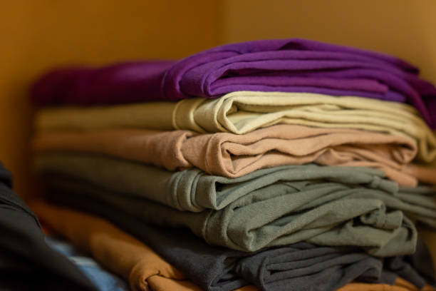 istock Stack of clothing t shirts folded in wardrobe 1939780663
