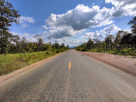 Empty road in the remote north of Preah Vihear province, Cambodia.