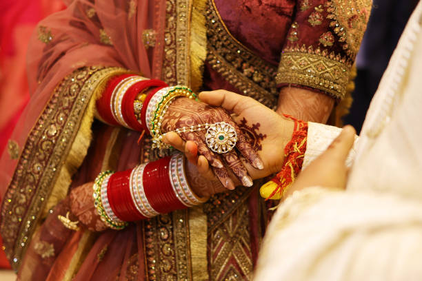 istock Groom hand in bride hand in indian wedding, Bonding concept 1939814283