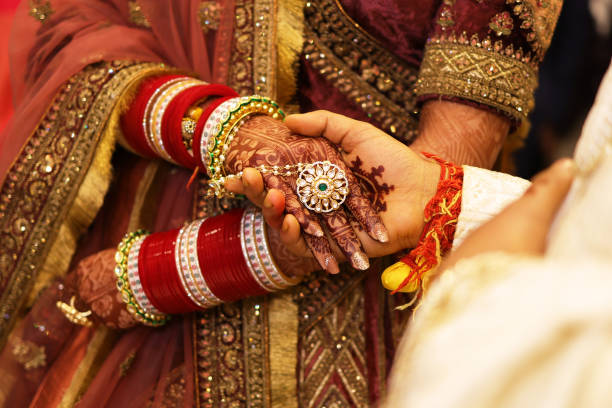 istock Bride groom holding each other hand, indian wedding 1939814618