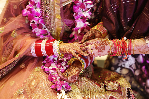 Mother giving ring to daughter at her wedding