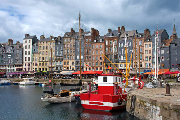 Honfleur, harbor basin with half-timbered houses and fishing boats