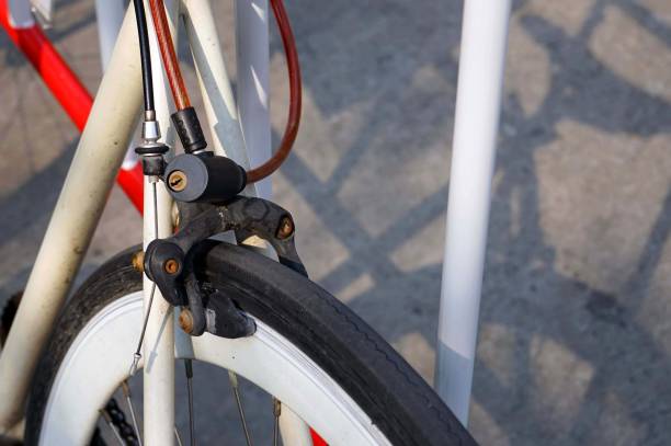 istock A bicycle stay stick a barrier traffic by sling cable key locked in a carpark. 1939854080