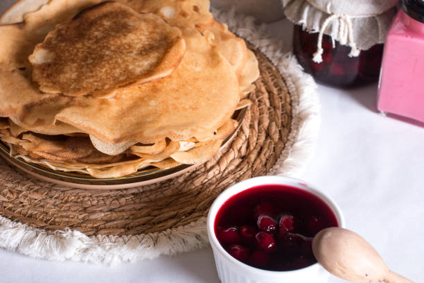 Maslenitsa holiday, pancakes with jam on the table. The Russian tradition