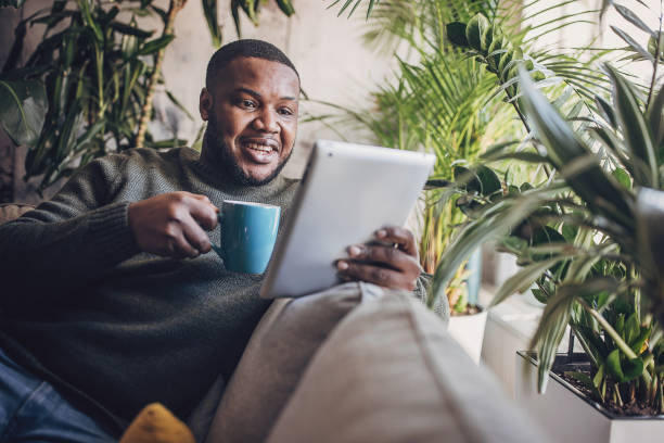 istock Man with Tablet Enjoying Morning Coffee 1939873380