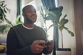 Focused Man Gaming Intensely on Console