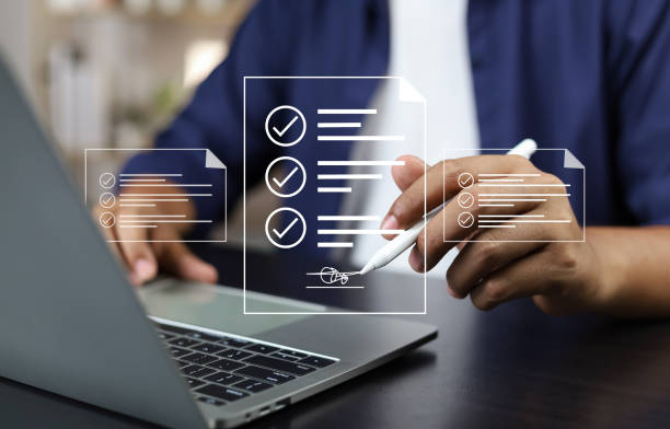 istock Electronic signature concept, E-signing, Business man using stylus pen signing contract electronic document on laptop, Document management, Sign agreement, E-documents for paperless transactions. 1939934001