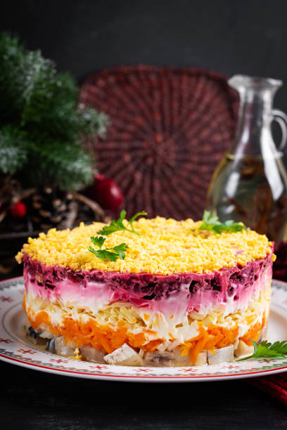 istock Traditional Russian multi layered salad from herring, beets, potatoes, carrots and eggs. Herring salad under a fur coat. 1939943126