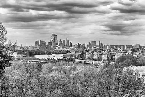 Panoramic view over the river Thames and the City skyline, as seen from the Royal Observatory in Greenwich Park, London, England, UK