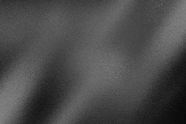 istock gray gradient grain texture background. gray black white monochrome smooth grainy background. 1939947671
