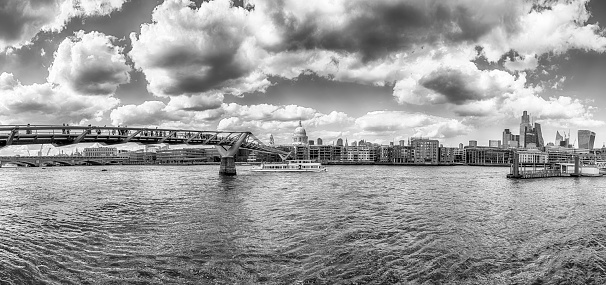 Scenic panoramic view over the river Thames and the skyline with Millennium Bridge and some of the major landmarks in London, England, UK