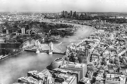 Scenic aerial view of London, over the river Thames towards Canary Wharf and Eastern London