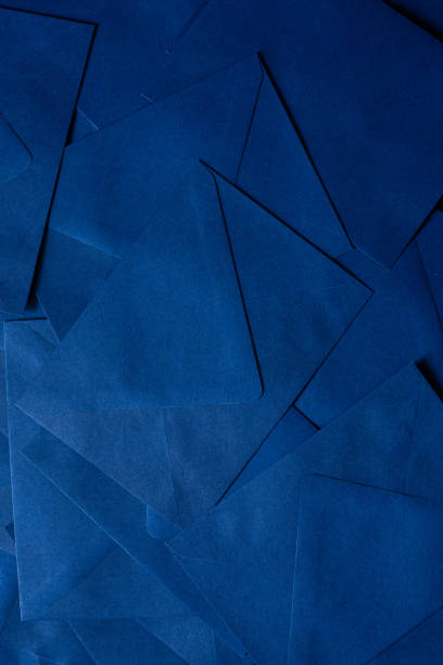 istock blue envelope background,Navy Blue Paper Envelope,Blue paper sheet texture cardboard background. 1939948256