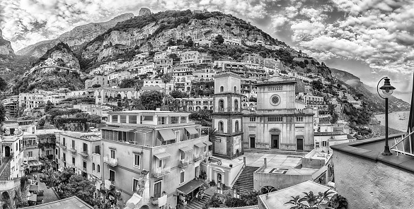 Panoramic view with the facade of the Church of Santa Maria Assunta, iconic landmark in Positano, on the Amalfi Coast of southern Italy