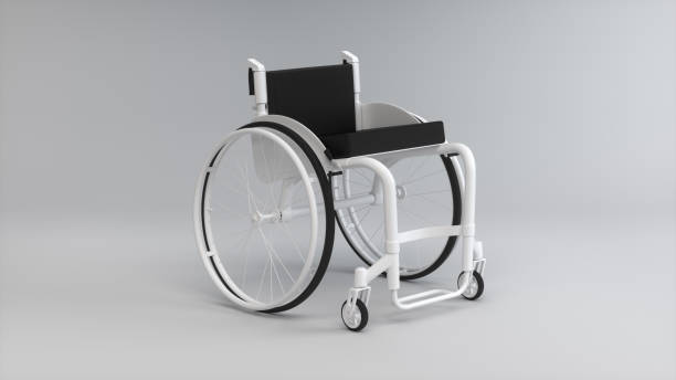 istock White Wheelchair on a Soft Gray Studio Background. Medicine concept. Perspective view. Monochrome. 1939955928