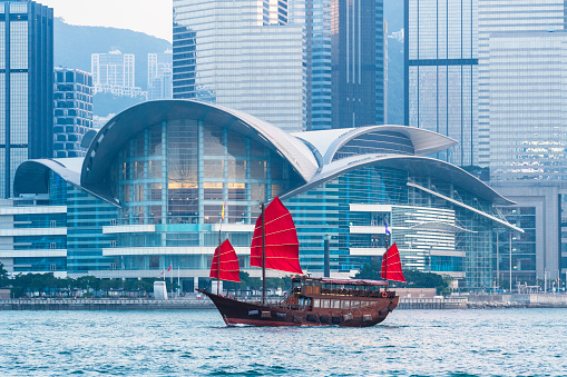 Traditional wooden junks in Victoria Harbor for short trips. It's an opportunity to take in panoramic views of Hong Kong's modern architecture.