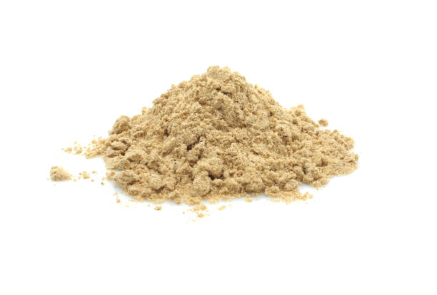 istock Ground ginger powder. Heap isolated on white background. 1939991692