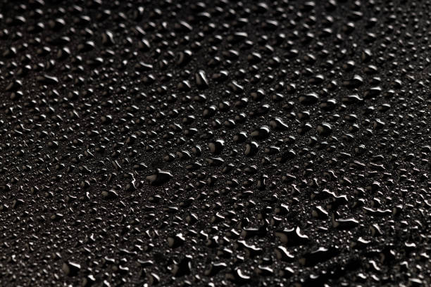 istock solid background of water droplets on a black plastic background 1939996612