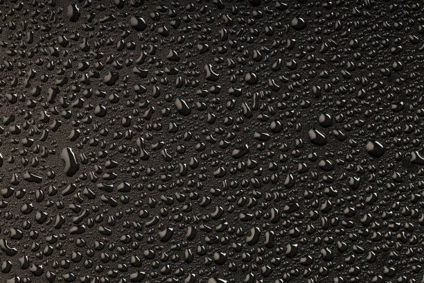 istock top view of water droplets on a plastic black background 1940010203