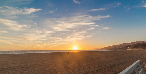 istock Sun shining over Santa Monica shore at sunset 1940038678