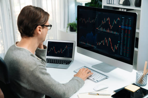 istock Business trader using computer and laptop to search high profit. Pecuniary. 1940045547