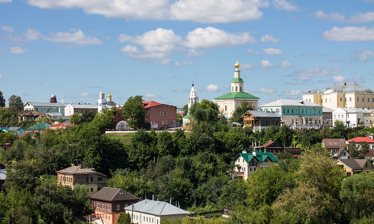 panoramic top view of the old city of vladimir with historical architecture among the lush green foliage of trees on a sunny summer day and copy space