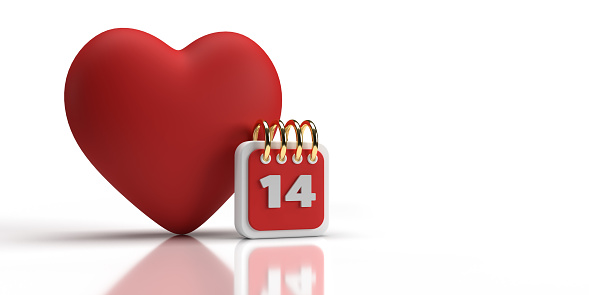 Red coloured heart on the back of a small valentine calendar. Valentine's day celebration and reminder concept. large copy space on white background. Easily changeable background and cuttable objects thanks to clipping path feature.