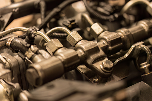 Close-up photo of common rail diesel injectors, highlighting the intricate components of fuel injection.