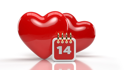 Red coloured 2 hearts on the back of a small valentine calendar. Valentine's day celebration and reminder concept. large copy space on white background. Easily changeable background and cuttable objects thanks to clipping path feature.