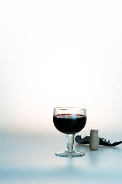istock glass of red wine with wine cork and corkscrew 1940091628