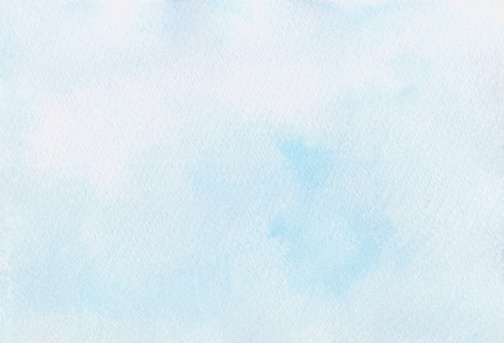 Light blue watercolor abstract background hand-drawn with space for text. A banner for design and decoration. The texture of watercolor on paper. An illustration of the sky with a gradient.