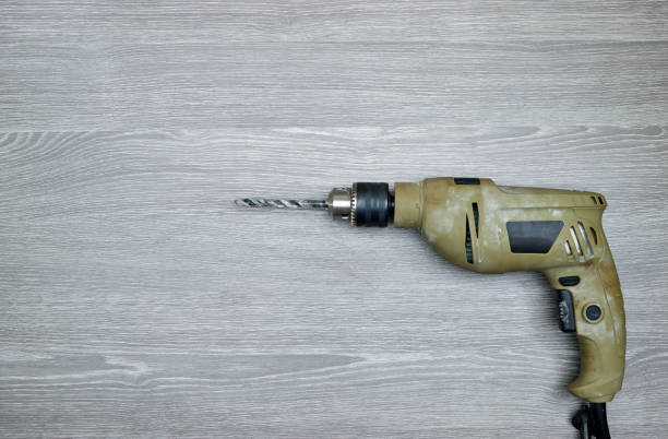 Metal drill for wood processing. In the background there are defocused drills.