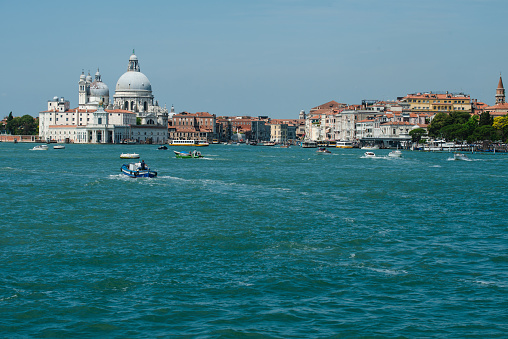 Venice, Italy – June 16, 2023: St. Mark's clock tower in Venice is an early Renaissance building on the north side of the Piazza San Marco, which date back to 15th century.