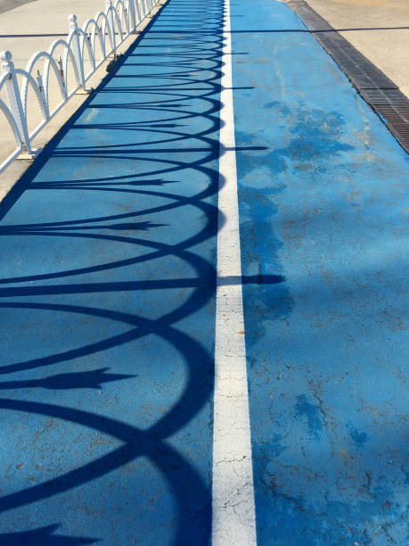 Bicycle and walking path shaded by metal rings